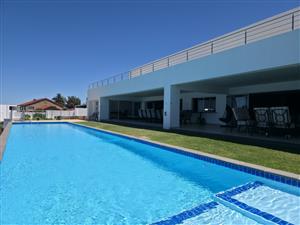 A Masterpiece of Coastal Luxury — Steps from the Beach