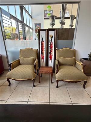 A pair of French-style upholstered armchairs (priced per chair)