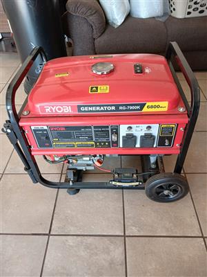 RYOBI 6800WATT GENERATOR. LIKE NEW