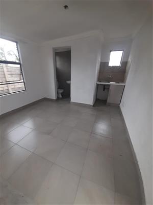  1 bedroom with ensuite bathroom with kitchenette, parking