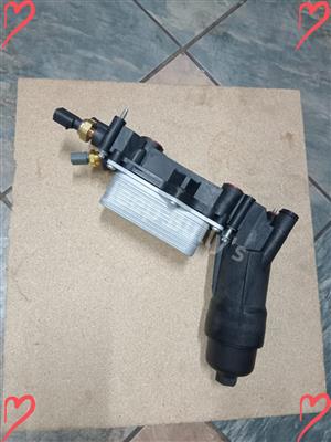 In Store Plastic Oil Cooler For 3.6 Vehicle  0100353425