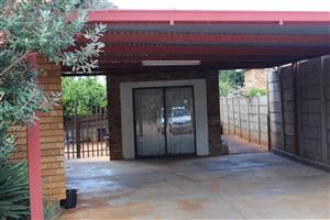 Bachelor flatlet with separate entrance and carport. Centrally located safe 