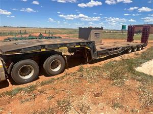 2020 SA truck bodies triaxle lowbed trailer, (+Vat), standing in Bloemfontein. 