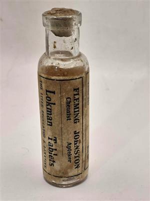Antique glass medicine bottle, "Lokman Tablets" from Fleming Johnston Chemist