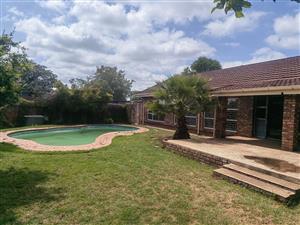 Spacious 5 bedroom 2 bathroom Lounge with study and a swimming pool home in a quiet neighborhood .