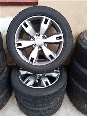 20" Ford Everest original mags with used 265/50/20 Goodyear still in good condition set.