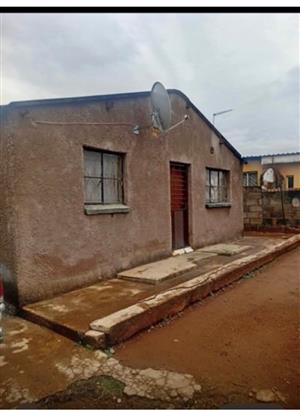 A HOUSE IN CWJ WITH 2 BEDROOMS,3 OUTSIDE ROOMS WALLED AND HAS A SECURITY GATE