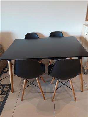 Nordik black rectangular table and four chairs.