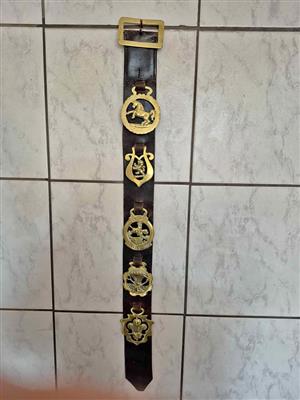 A vintage Martingale, decorated with horse brasses.