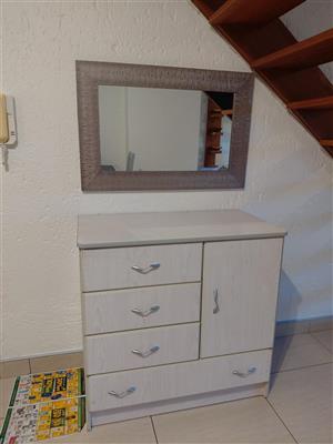 Chest of drawers and mirror