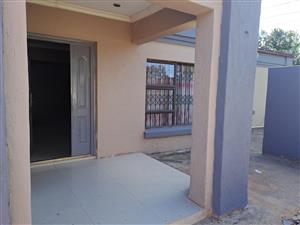 Three bedroom house with 2 bathrooms (M.E.S.), double garage and spacious yard to rent