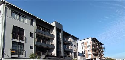 Spacious Two-Bedroom, Two-Bathroom Apartment One Road from the Beach