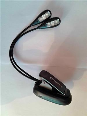 Music stand light with a dual-arm design.Cherry branded CL-004 LED.