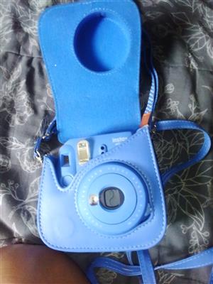 Camera Instax basic new it a Baby Blue color still in it bag urgent sale I want 