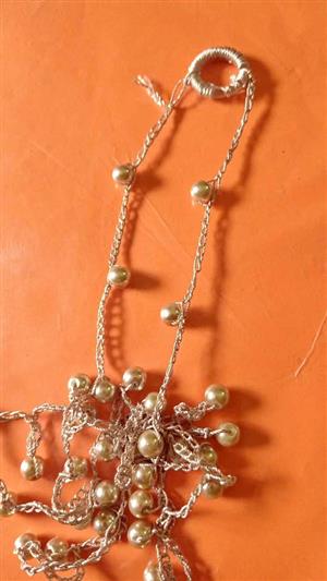 "tangled pearl necklace"