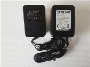 Adapters Netgear 230VAC to 12VAC 1500mA. And 230VAC to 7,5VAC 1A. In good workin