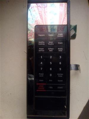 A Samsung 10 years warranty side keypad, display and door switch front panel.