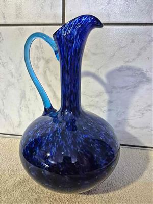 Vintage Murano art glass pitcher vase with a blue swirl pattern and a clear applied handle.