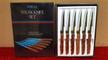 Lovely set of wooden handle steak knives.
