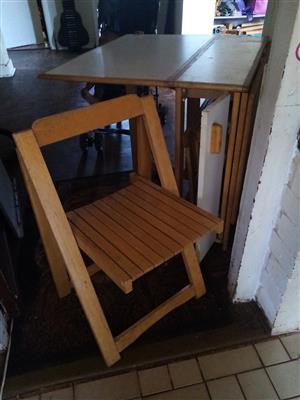 Table and chairs unit, folds away 