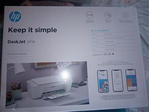 selling a new Deskjet 2710 HP Printer with included two new cartridges