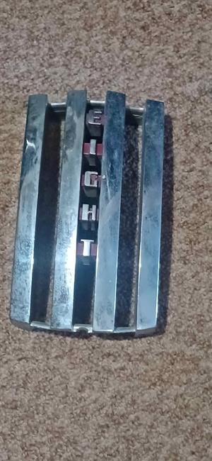 Mercury Eight, grille badge