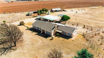 This property with a beautiful main house is 1 of 4 sections on this piece of land.