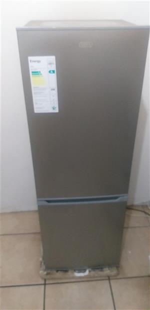 A very clean defy fridge available for sale.