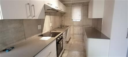 Wake up every morning to the sound of a tranquil stream passing through the townhouse complex