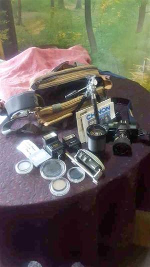 Cp 7m chinon slr camera with multiple accessories.
