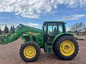 John Deere 6330 with Loader Bucket and Forklift attachment