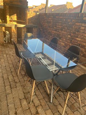  Glass Dining Table with Wooden-Foot Chairs