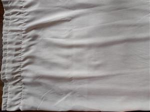 A set of cream/light beige curtains 220L x 200W. 