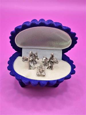 Miniature nativity scene set in a blue velvet, shell-shaped box