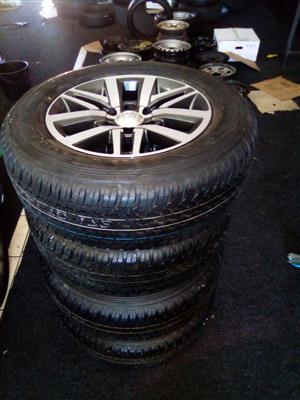18" Toyota Hilux/Fortuner mags with brand new 265/60/18 Dunlop Grandtrek A/T set