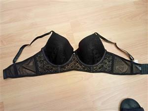 Bra black underwired balconette 36D  intricate floral lace detailing small center bow with a rhinest