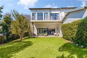 Discover an exquisite, brand-new residence nestled in the prestigious Helderfontein Eco Estate.
