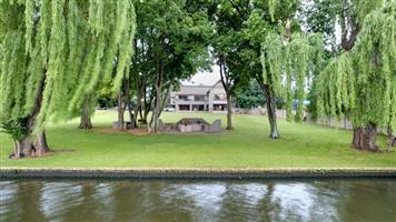 Exceptional Riverfront Estate with Luxury Living & Prime Development Potential