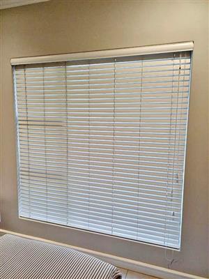 White wooden window blind