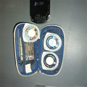 PSP with charger, five games and memory card.