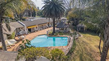 Stunning 4-Bedroom Family Home with Cottage, Pool & Staff Quarters in Bryanston