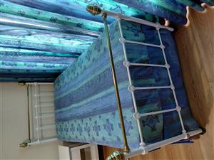 Single steel bed with roll away bed underneath.
