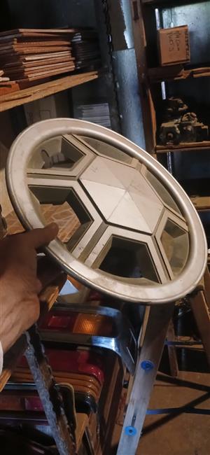 Datsun older car, wheel caps