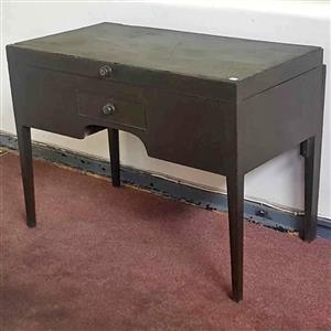 Antique vanity cabinet with a drawer and lift up top