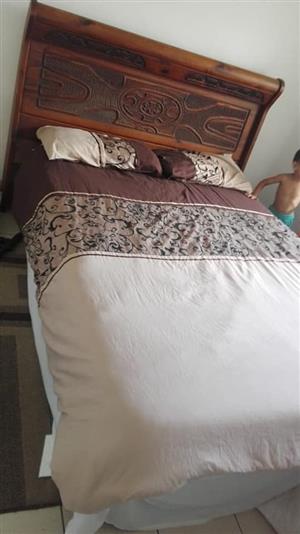 Double bed with custom wooden headboard