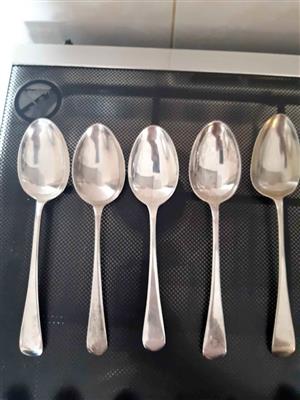 Vintage silver-plated tablespoons feature a classic, elegant design, mid-century flatware.  