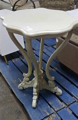 Round white side table