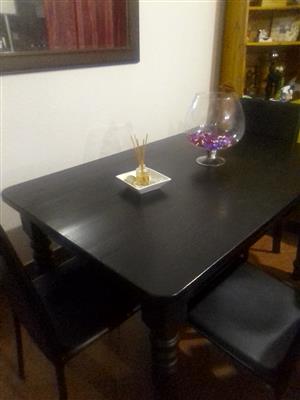 4 black chairs and a dinning room table for sale 