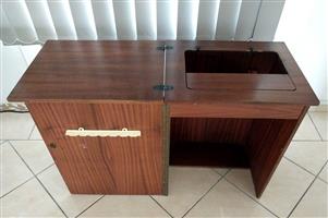 Sewing machine cabinet