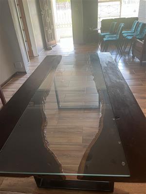 Solid rough wooden dining table with reinforced glass top